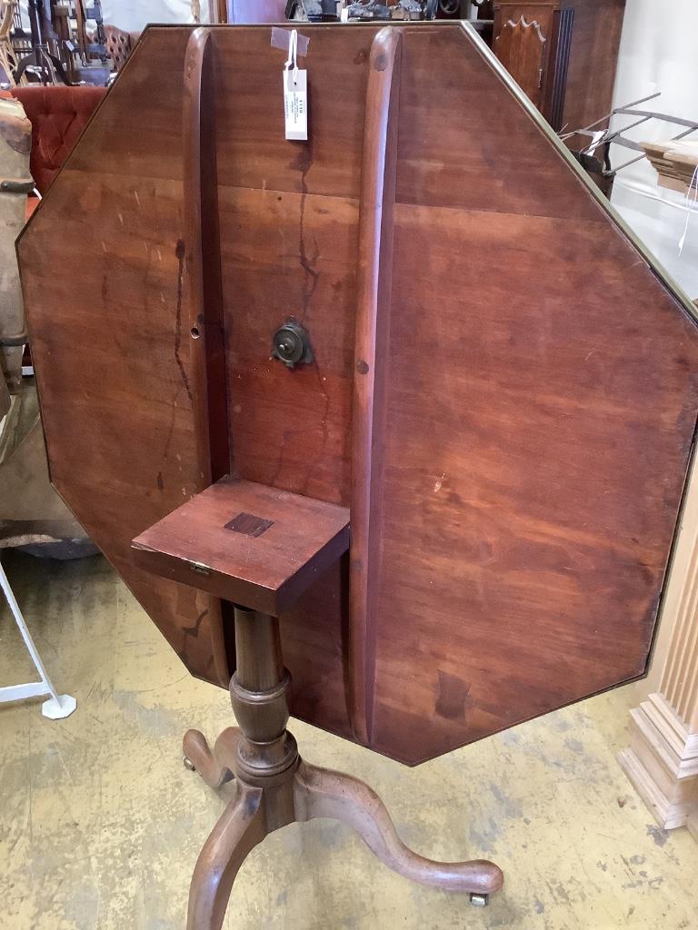 Two similar George III parquetry inlaid mahogany octagonal tilt top tables, width 96cm, height 73cm